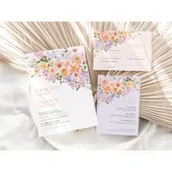 Spring floral wedding invitation template featuring peach and purple watercolor flowers, modern script font, editable and printable design.