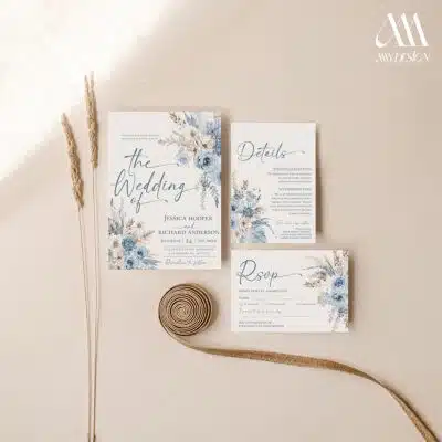 Dusty blue boho wedding invitation with pampas grass and floral design