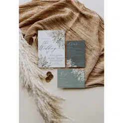 Bohemian wedding invitation card in sage green with rustic floral accents