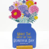 DIY floral desk calendar for 2026 showing a blue jar-shaped card with a 