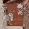 Western Boots and Bubbly Bridal Shower Invitation | Cowboy Boot Invite Editable Template | Terracotta Rustic Boho Boots and Bubbly bridal shower invitation on a terracotta background featuring watercolor cowboy boots, champagne, and pampas grass florals.